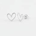 Clean Sterling Silver Heart Earrings on White Paper Background