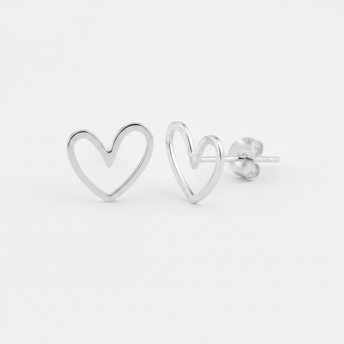 Clean Sterling Silver Heart Earrings on White Paper Background